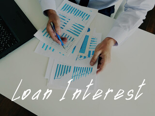 Financial concept meaning Loan Interest with sign on the page.