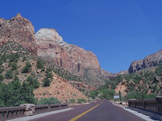 Winding road with breathtaking landscape and mountain peaks at Zion National Park, Utah, USA.