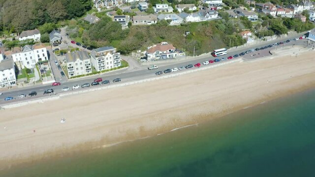Drone flying in from over the sea toward the beach in England