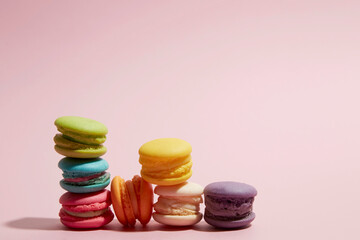 colourful macaroon on pastel pink background