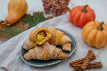 Sweet home made pumpkin crescent rolls on a table