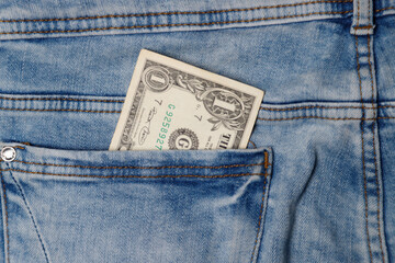 1 dollar in the pocket of blue jeans