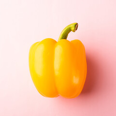 Close up above top view of raw yellow bell peppers on pink pastel background, fresh organic vegetables, Healthy lifestyle diet food concept