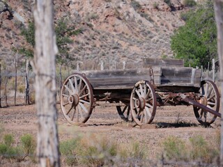 Fototapeta na wymiar Old harvesting machine with rusty wheels displayed along the road at the Grafton ghost town, a town washed away by the Great Flood of 1862, Utah.