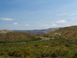 Scenic landscape view with a winding road in Wyoming close to the Montana state line.