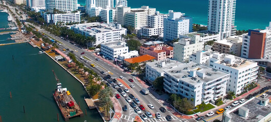 Fototapeta na wymiar Miami Beach aerial view, Florida from drone viewpoint. Indian Creek and city skyline on a wonderful sunny day, slow motion.