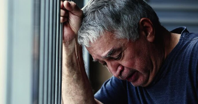 Senior man crying, person in emotional distress. Old man in pain