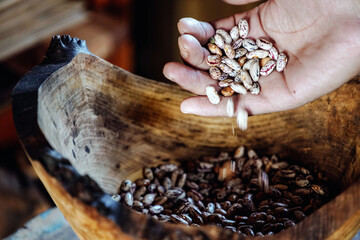 Wooden box and raw beans on grey background, flat lay with space for text. Vegetable seeds