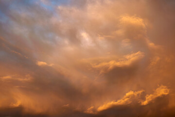 Sky at sunset and red fluffy clouds, skies background. 