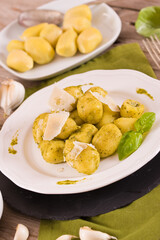 Potato gnocchi stuffed with pesto sauce.