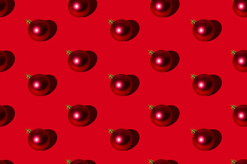 Christmas ball pattern. Red seamless background. New Year party ornament. Winter holidays adornment. Round shimmering glitter bauble symmetrical composition isolated on bright.