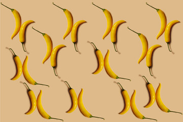 Vegetable pattern. Repetition of yellow chili peppers on a beige background. Beautiful pattern from natural vegetables. Horizontal. The concept of healthy food and vegetarianism.