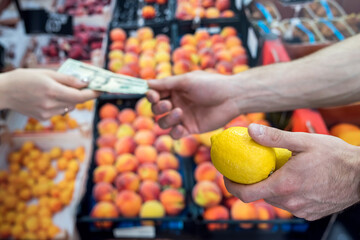 man who takes care of his health buys fruit in a store