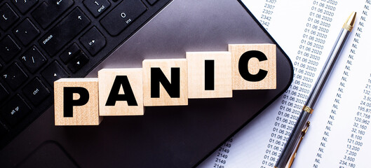 The word PANIC is written on the keyboard on wooden cubes near the handle.