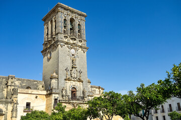 Fototapeta na wymiar Bell tower of Santa Maria de la Asuncion church in Arcos de la Frontera, Spain