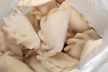 close-up of frozen dumplings in plastic bag