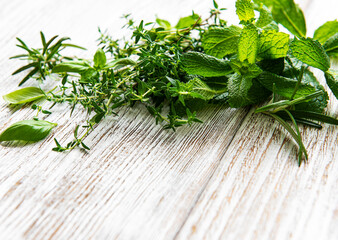 Fresh herbs cut in home garden, on wooden rustic table