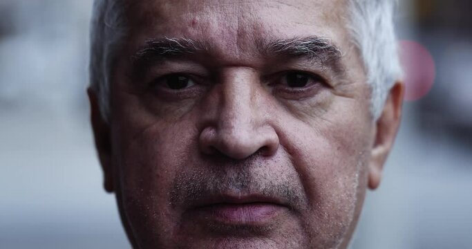 Serious older man portrait looking at camera