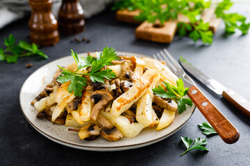 Potato fried with champignon mushrooms