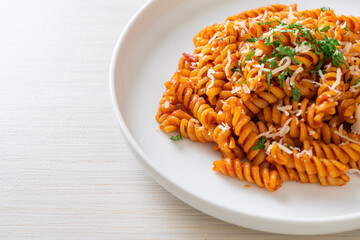 spirali or spiral pasta with tomato sauce