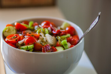 Traditional summer salad with tomatoes, cucumbers and peppers