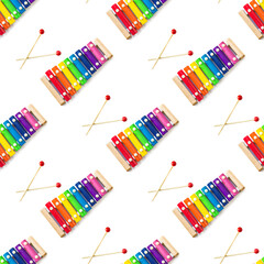 Seamless pattern of Rainbow Colored Wooden Toy 8 tone Xylophone glockenspiel isolated on white...