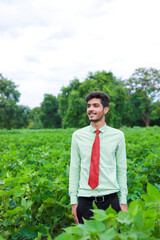 Naklejka na ściany i meble young indian agronomist at field