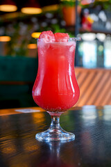 Refreshing passion fruit red juice in glass. Delicious summer cocktails.