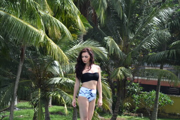 Obraz premium Woman wearing a bikini posing in the summer time