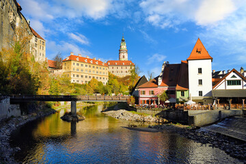 Water reflection of State Castle and Chateau Cesky Krumlov, Czech Republic in the Old Town, afternoon with blue sky and beautiful clouds.