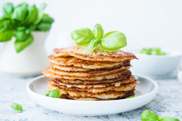 Potato pancakes with herbs and sour cream, Russian, Belarusian cuisine, selective focus