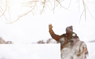 A man on a walk. Winter landscape. Tourist in winter journey.