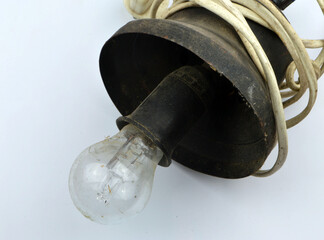 
old electric lamp lies on a white background
