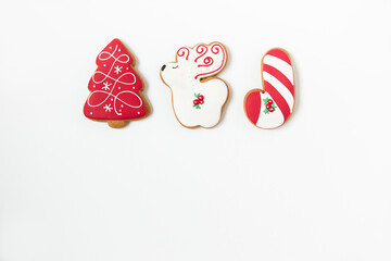 new year and christmas gingerbread cookies. tree shaped and deer. white background. minimalist style. copy space