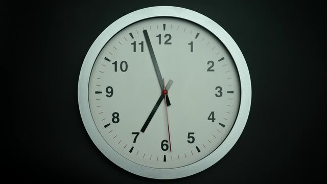 Wall clock isolated on black background, Showtime 06.57 am or pm, Second hand minute Walk, Time concept.
