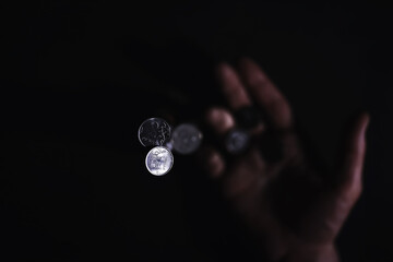 Volatility of the national currency. Russian coins with the inscription "ruble". Low ruble exchange rate. Fall of course. Financial crisis. Ruble in the hand.