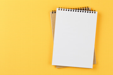 open notebook on corrugated yellow background