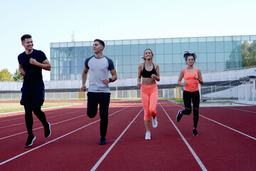 Obraz premium Group running on an athletic track