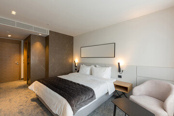 Fototapeta na wymiar Interior of a luxury master bed hotel bedroom