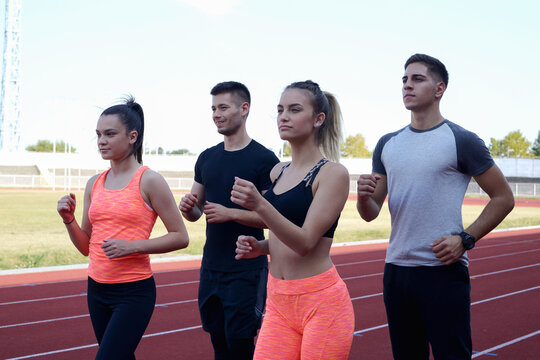 Group  running on an athletic track