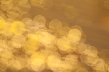 Golden bokeh background with glowing backdrop baubles