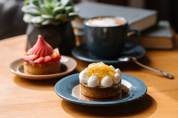 Sweet strawberry cupcake on the wooden table