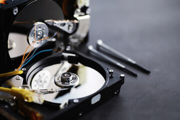 Computer accessories. The disassembled hard drive. Repair of components PC. Broken external hard drive. Computer background.