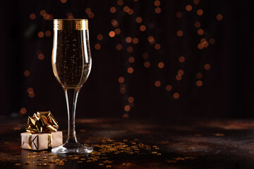 selective focus of glasses full of champagne against christmas lights
