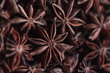 Anise star seeds background texture, copy space, close up. Top view, flat lay
