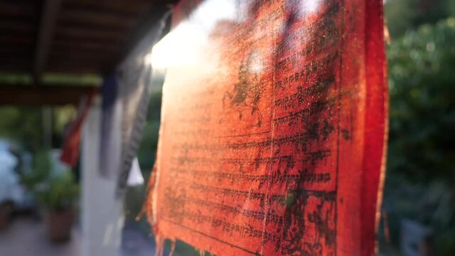 Sun Shining Through Tibetan Buddhist Flag, Close Up