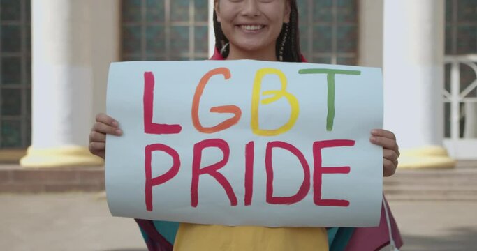 Tolerant young woman showing lgbt pride sign, same-sex love acceptance, support
