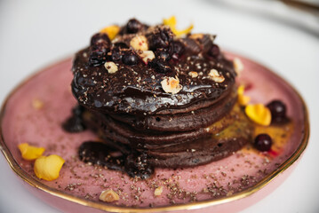 stack of pancakes with chocolate sauce