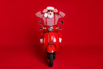 Portrait of his he handsome amazed wondered impressed stunned funny cheerful bearded Santa riding...