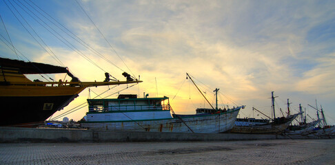 fishing boats at sunset